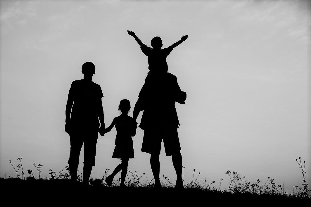 Family silhouette at sunset